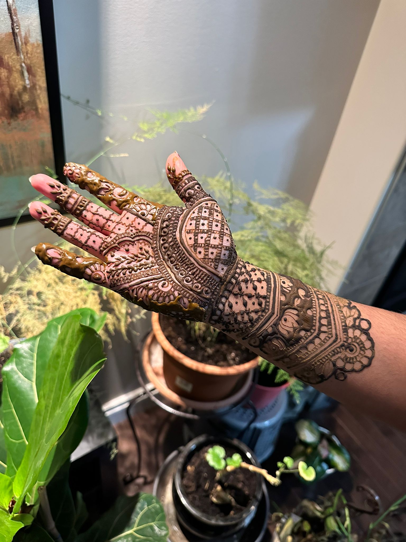 Intricate bridal mehndi with plants background Edmonton
