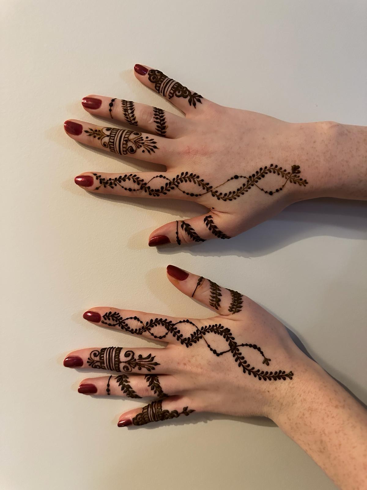 Matching vine henna design both hands Edmonton party